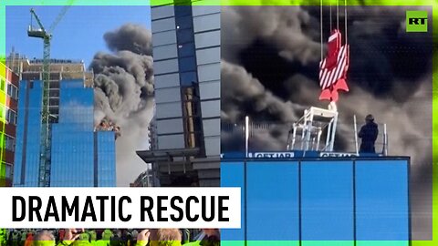 Crane driver rescues man trapped on top of burning tower block