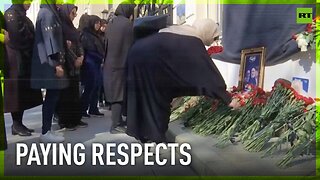 Russians lay flowers to honor President Raisi