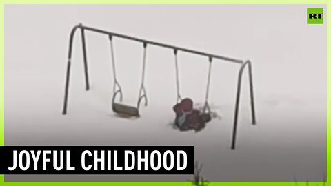 Russian kid determined to play on swing buried in snow