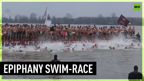 Orthodox Christians celebrate Epiphany with traditional swim-race in Danube