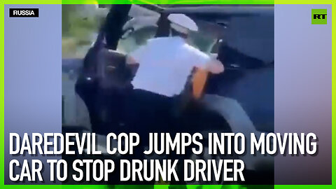 Daredevil cop jumps into moving car to stop drunk driver