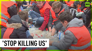 Climate activists glue themselves to Berlin road