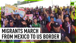 Thousands of migrants march from Mexico to U.S. border