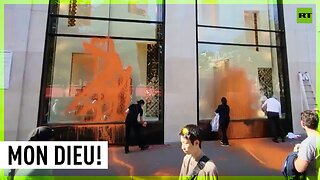Louis Vuitton shop painted orange by eco-activists