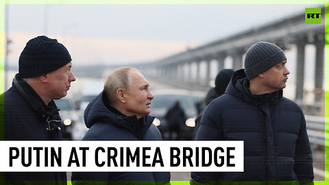 Putin visits Crimean Bridge, drives across it