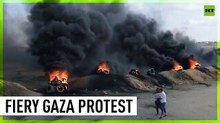 Smoke rises as Palestinians rally in Gaza