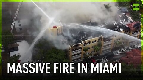 Massive fire engulfs residential building in Miami