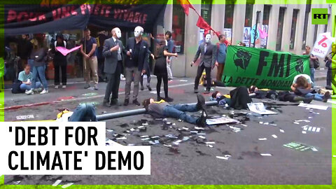 XR activists glue themselves to IMF Paris office