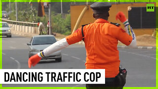 Nigerian traffic cop controls cars with dance