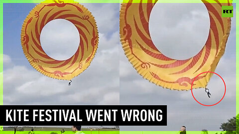 Man blown into the sky at Wuhan kite festival