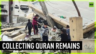 Children collect Quran fragments amidst debris of destroyed mosque in Gaza