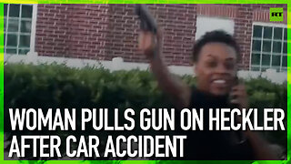 Woman pulls gun on heckler after car accident