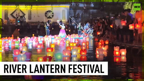 Hundreds of lanterns light up China's Zijiang river for Zhongyuan Festival