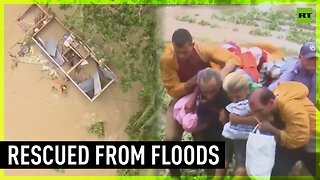 Emergency teams rescue people from floodwaters in Cuba