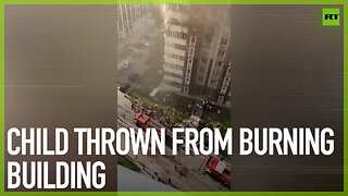 Child thrown from burning building