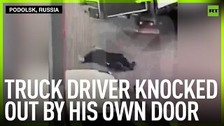 Truck driver knocked out by his own door