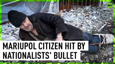 Senior Mariupol citizen crawls away from the Azov nationalists territory
