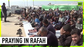 Displaced Palestinians pray in Muwasi camp in Rafah