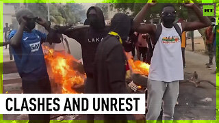 Cars and tires burnt as protesters rally in support of opposition leader in Senegal