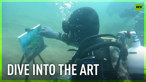 Artist diver paints at bottom of Black Sea