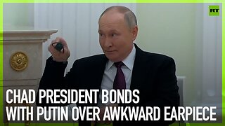 Chad President bonds with Putin over awkward earpiece