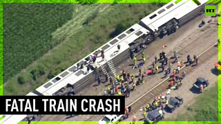 Train derails in deadly crash with truck