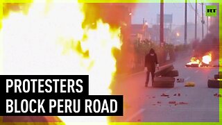Protesters set fires to block major highway in Lima