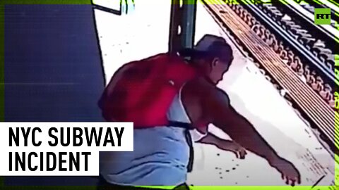 Man arrested after throwing woman onto subway tracks