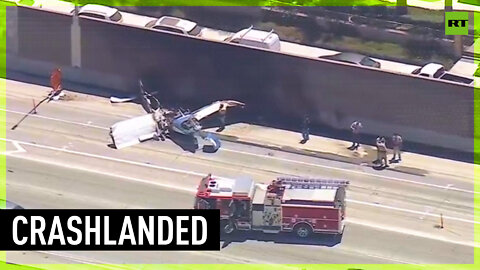 Plane crash lands on California freeway