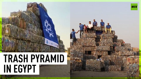 Environmental activists build giant trash pyramid