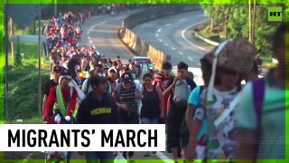 Thousands of migrants march through Mexico toward US