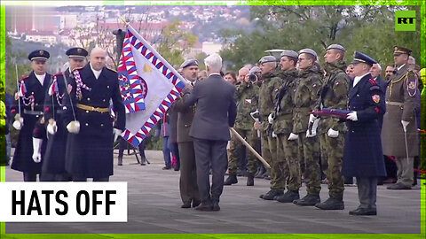Czech president knocks off soldier’s hat with a flag