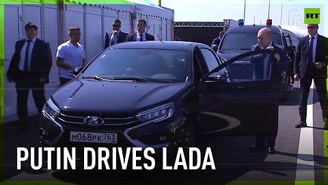 Putin drives Lada at highway section opening