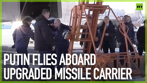 Putin flies aboard upgraded missile carrier