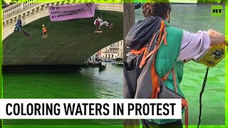 Climate activists dye Venice waters green