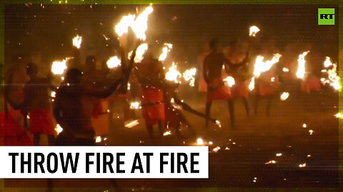 Indian devotees participate in fire-throwing fight ritual