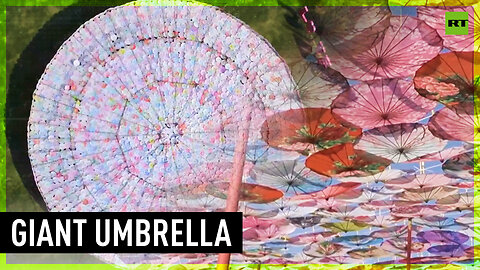 Artists combine 8,000 traditional Chinese parasols for 'umbrella in the sky' installation