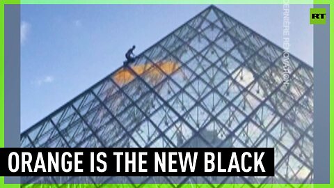 They're at it again | Environmental activists paint Louvre pyramid orange
