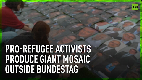 Giant mosaic made of politicians’ portraits produced by pro-refugee activists in Berlin