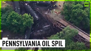 Pennsylvania train derails with oil leaking into river
