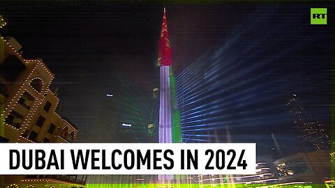 Iconic Dubai tower illuminated with Palestinian flag colors during New Year fireworks show