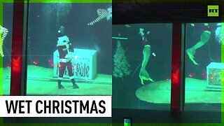 Santa Claus and world-famous mermaids perform underwater holiday show