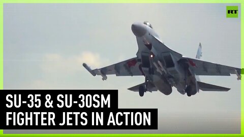 Su-35 and Su-30SM fighter jets strike enemy strongholds