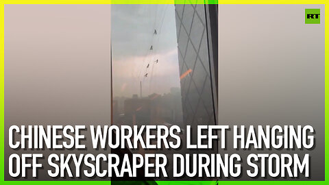 Chinese workers left hanging off skyscraper during storm