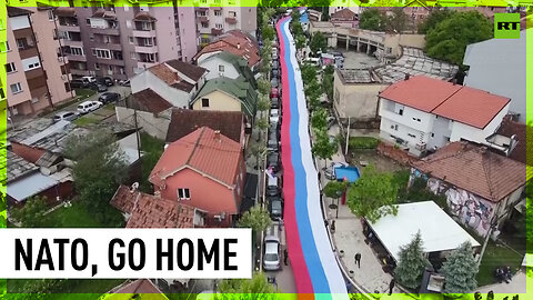 Giant Serbian tricolor unfurled in protest against NATO troops in Kosovo