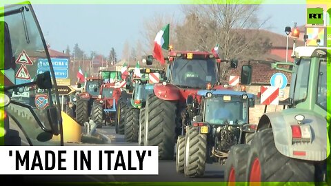 Italian farmers block highway with hundreds of tractors
