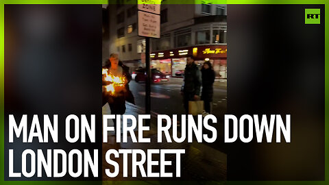 Man on fire runs down London street