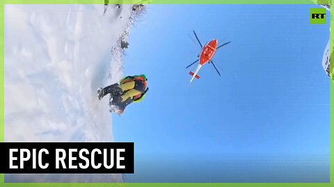 Italian emergency crew rescues mountaineers stranded in icy gully