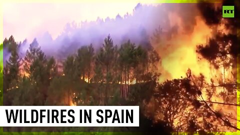 Firefighters battle flames in western Spain