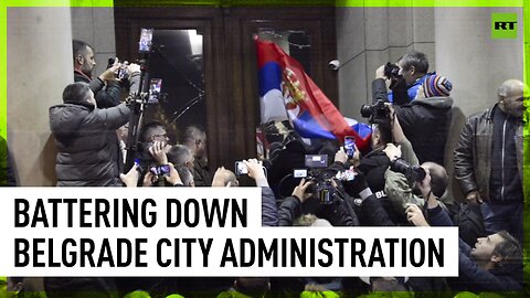 Protesters batter down doors of Belgrade city administration